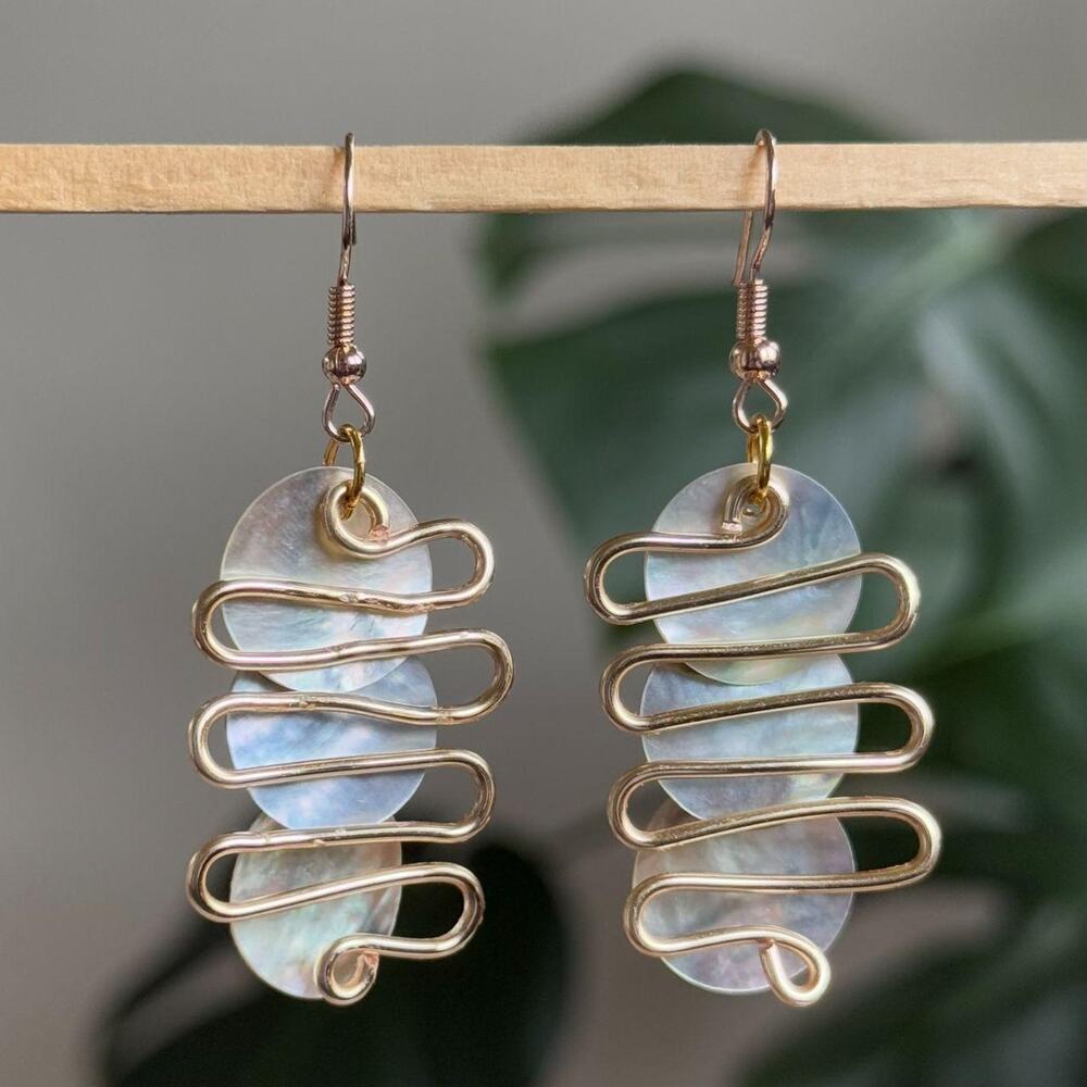 handmade switchback gold wavy earrings with mother of pearl iridescent discs
